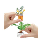 two minis being held with fingers