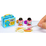 Miniature sandwhich and a small blue lunchbox with 'CHOMP!' on it