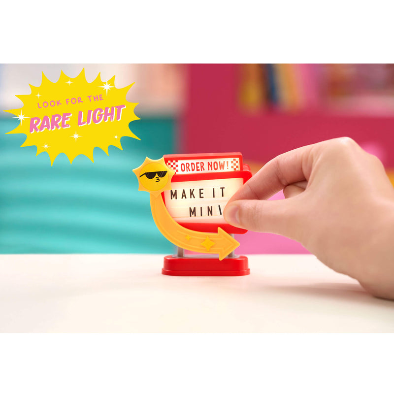 Hand interacting with the Rare small light-up sign with text on a colorful background