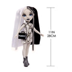 Doll with black and white hair, wearing a dress and holding a handbag, with measurements indicated.