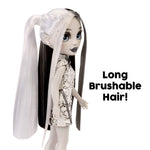 Doll with long brushable hair and sequin outfit on a white background