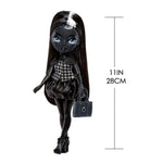 Black doll with measurements on a white background