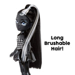 Black doll with long brushable hair and a houndstooth dress on a white background.