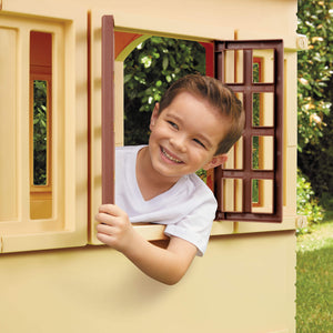 Little Tikes Cape Cottage Playhouse - Tan - boy looking out window