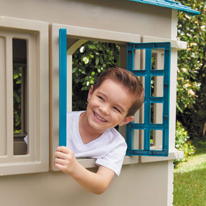 Little Tikes Cape Cottage Playhouse - Blue - child looking out window