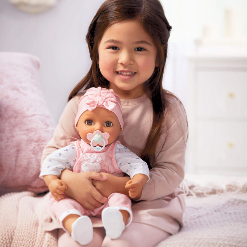 Girl holding Baby Doll Ava