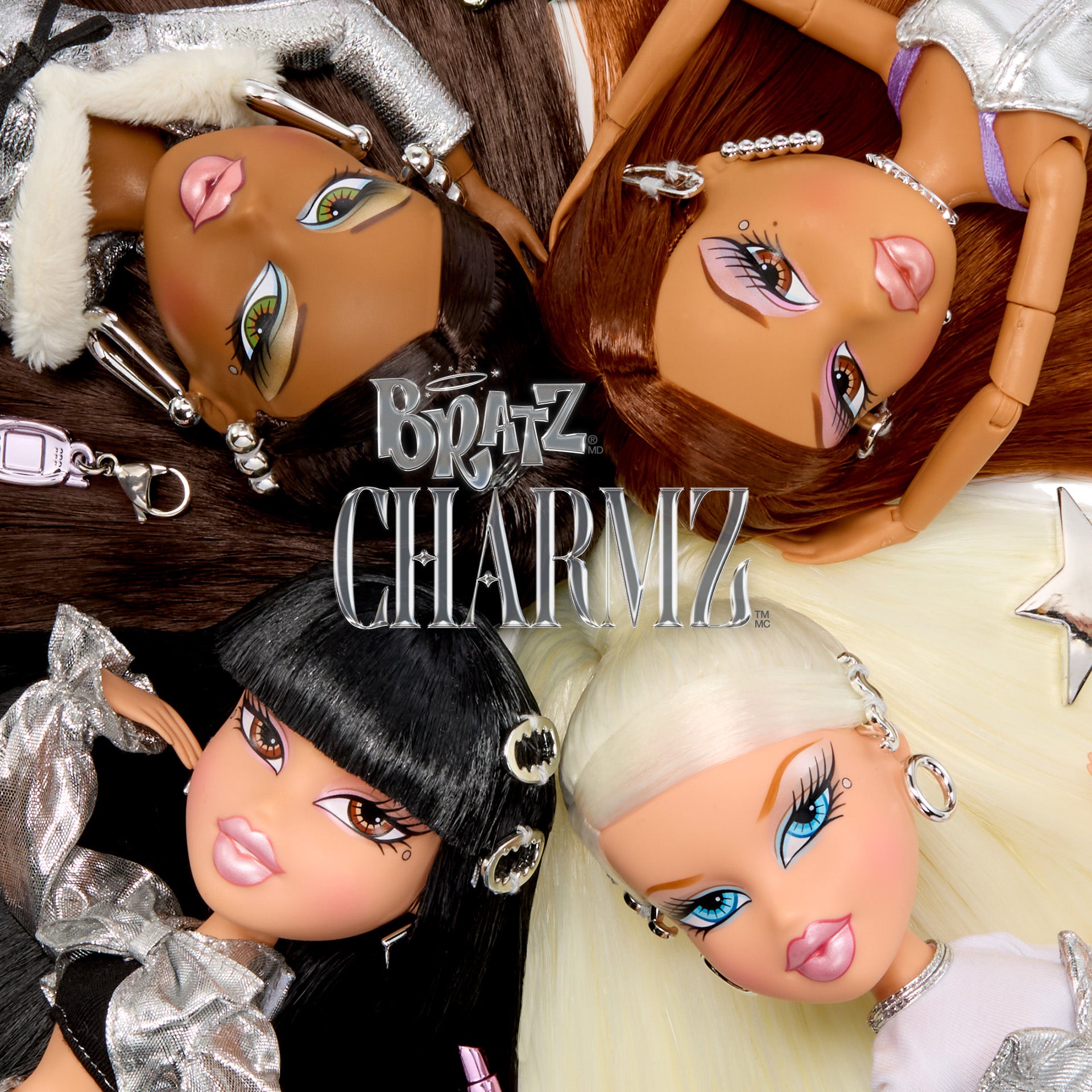 Four Bratz Charmz dolls with various outfits and accessories on a white background.