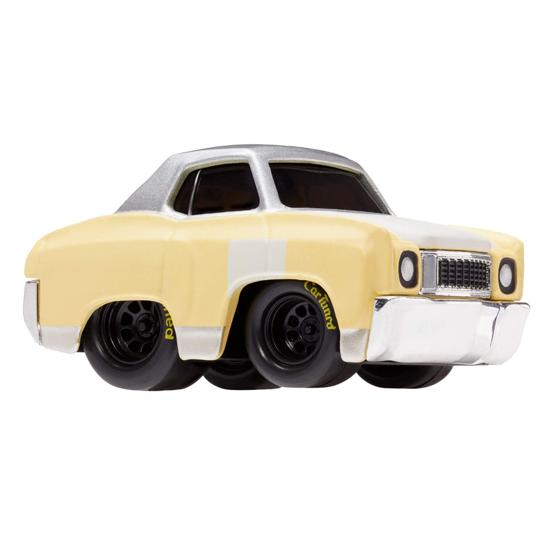 A toy metal car with a light yellow body, silver roof, and black wheels with ‘CarTuned’ in yellow, shown on a plain white background.