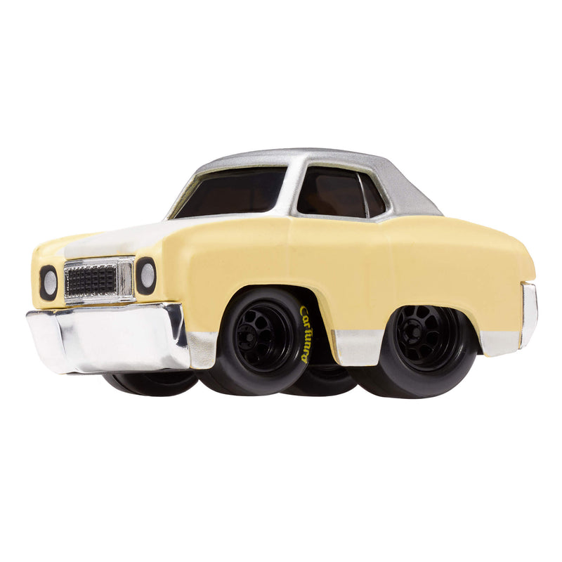 A toy metal car with a light yellow body, silver roof, and black wheels with ‘CarTuned’ in yellow, shown on a plain white background.