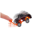 Toy car with a hand pushing on an orange handle against a white background