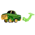 Toy truck with gold accents and a green attachment on a white background