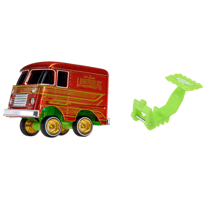 A toy van with glittery red body, and a separate lime green hitch accessory, shown on a plain white background.