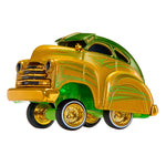 A miniature hot rod toy car with a metallic gold glitter finish, green glow underneath, and bright green accents, shown on a solid white background.