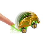 A miniature toy car with a metallic gold body and green roof, being pushed by a human finger on a plain white background.