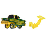 A green and gold toy classic car with black wheels, shown next to a yellow plastic mounting bracket on a plain white background.
