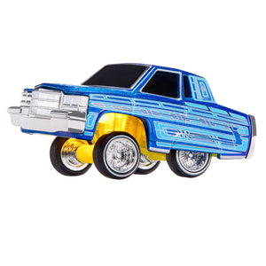 A die-cast metal toy car with a custom lowrider design, featuring a metallic blue body with light blue graphics, a silver-colored front bumper and wheel wells,  shown on a plain white background.