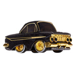 A toy metal car with a black body, gold trim, and gold wheel rims with white walls, shown on a plain white background.