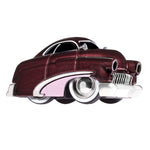 A toy metal car with a burgundy body, white trim and a pink fender with black, white wall tires, shown on a plain white background.