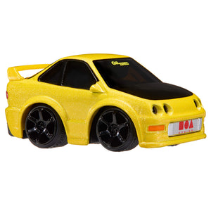 Yellow Acura Integra with black windows, black rims, and the license plate has a red square, a circle and triangle with text 'Design'.  Text ‘CarTuned’ on windshield on a white background