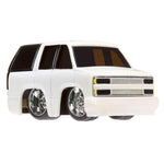 White Suburban with black windows on a white background