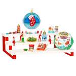 Various mini holiday items on a red and white platform on a white background