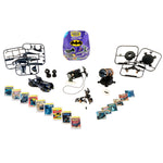 A Batman-themed mini toy set laid out on a white background, including a small black RC car, two black RC drones with frames, a purple Batman-branded storage box, several small accessory pieces, and multiple comic book cards or inserts arranged in rows.