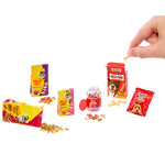 Mini pet food items on a white background, with a hand taking a Milk-Bone out of the box.
