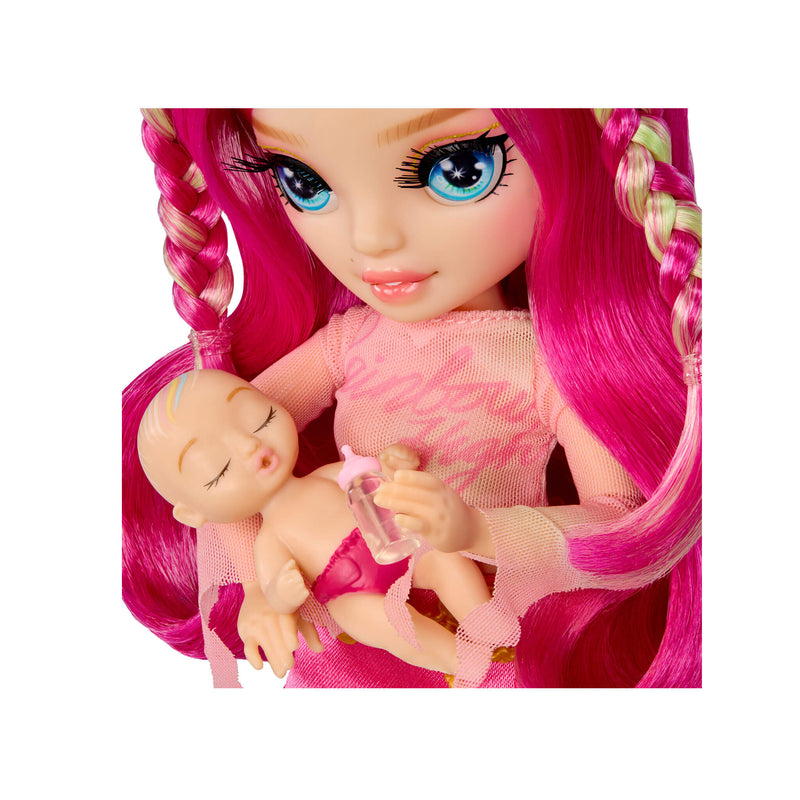 Close up of doll holding baby on a white background