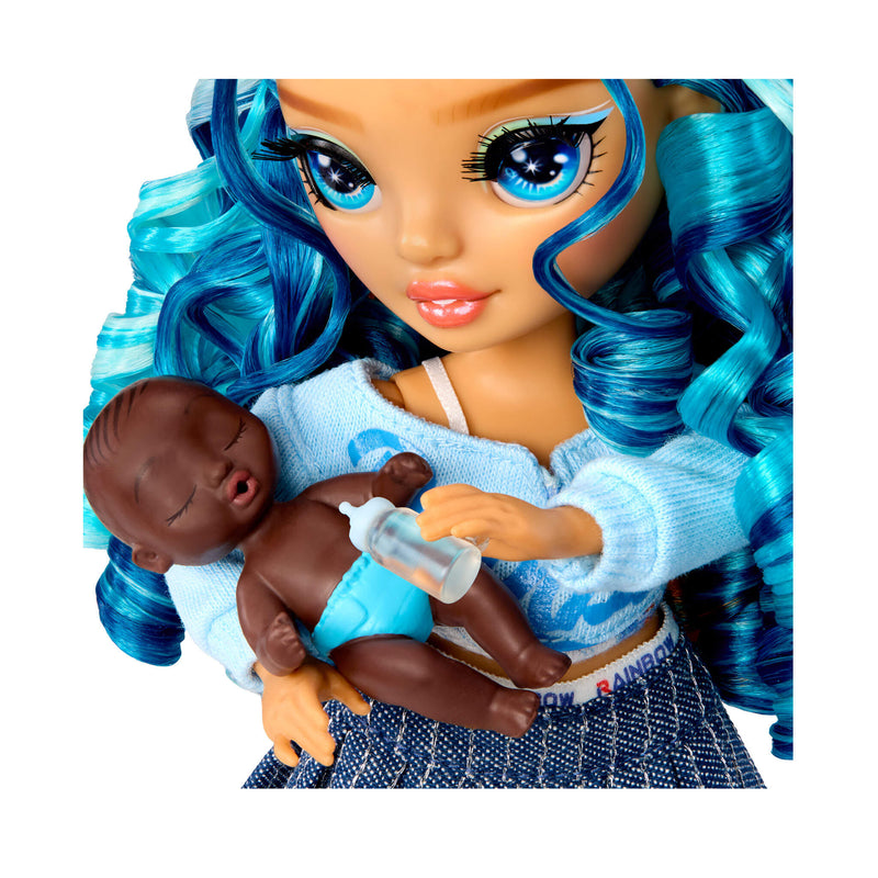 Close up of doll holding baby on a white background