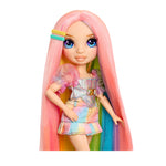 Doll with pink hair and colorful outfit on a white background