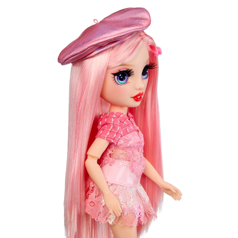 Doll with pink hair and outfit on a white background