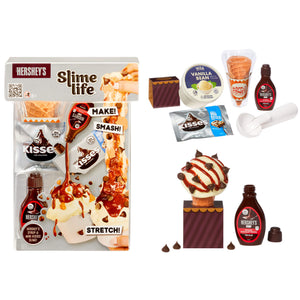 Hershey's Slime life set with various chocolate-themed ingredients and accessories, including mini Hershey's Kisses, vanilla bean, syrup, and a finished slime ice cream cone, displayed on a clean white background.