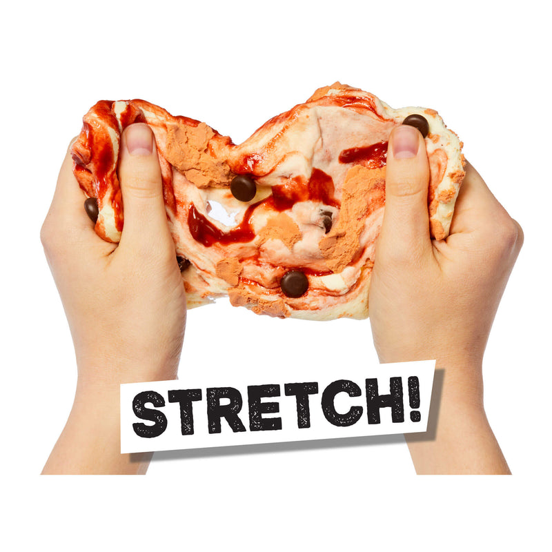 Two hands stretching slime made to look like an ice cream cone with dark syrup and chocolate chips, with a white sticker overlay that says 'STRETCH!'.