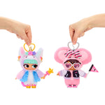 Two colorful keychains held by hands against a white background