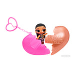 Heart keychain shown in two pieces with a small doll in the middle on a white background.