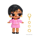 Tot doll in pink dress with accessories to the right side. 