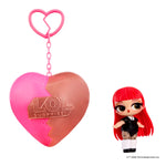 Small doll with red hair with a heart shape keychain on a white background