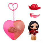 Small doll with black hair – sunglasses and red cowgirl hat with a heart shape keychain on a white background