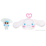 White plush toy with blue accents and a small figure on a white background