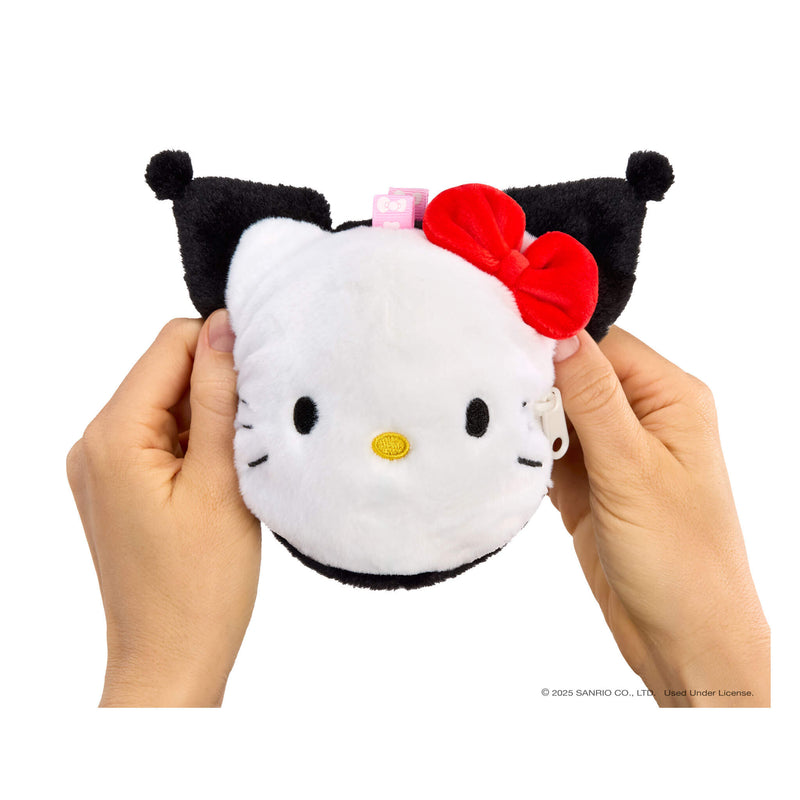 Plush toy resembling a cat with a red bow held between two hands on a white background being transformed