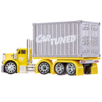 A yellow toy semi-truck with a silver container carrying the words 'CAR TUNED' in white, shown on a plain white background.