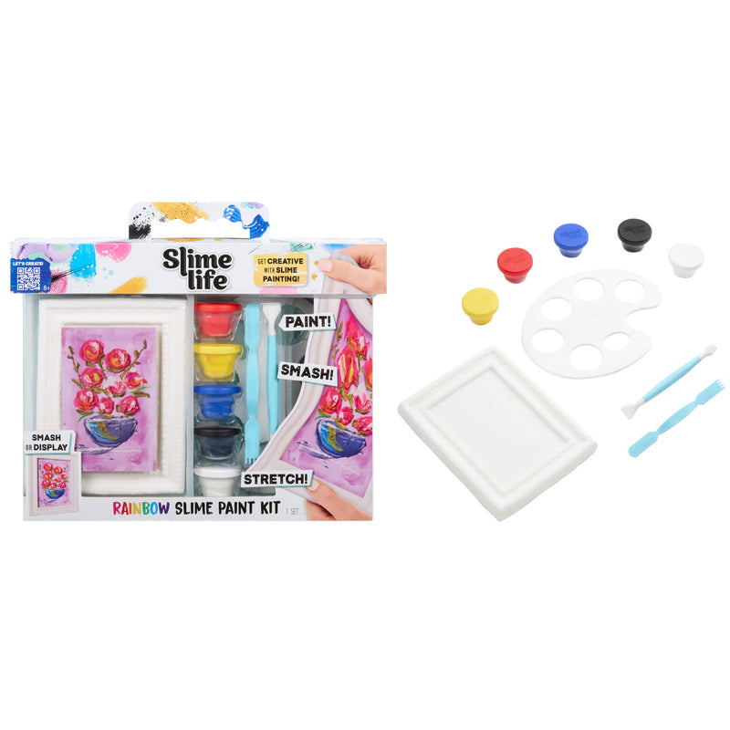 Rainbow Slime Paint Kit shown both in its retail packaging and unpackaged, featuring a white display frame with a colorful painted flower design, small paint pots in red, blue, yellow, black, and white, a white palette, two blue applicators, and a white tray on a plain white background.