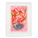 A framed painting of a pink floral bouquet in a blue bowl, set against a solid white background.