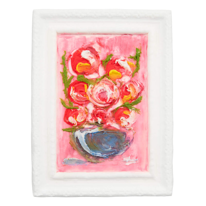 A framed painting of a pink floral bouquet in a blue bowl, set against a solid white background.