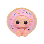 Donut-shaped toy with a face on a white background