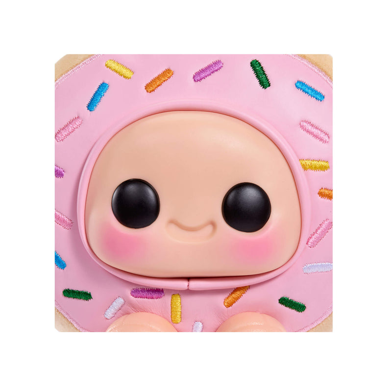 Toy figure with a pink donut-shaped head on a white background
