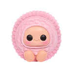 Pink textured toy  cookie with a smiling face on a white background