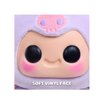 Close-up of a soft vinyl toy with a purple outfit on a white background.