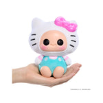 Toy figure with a Hello Kitty design held in a hand on a white background
