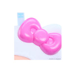 Pink bow-shaped object on a white background